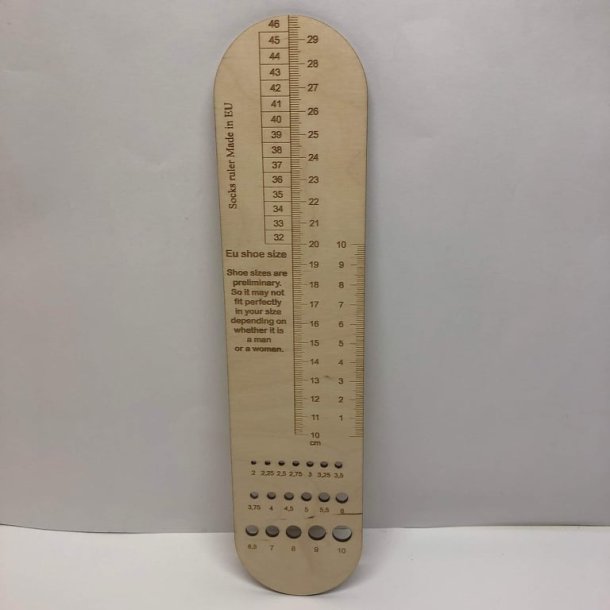 Strmpelineal med pindemler i tr